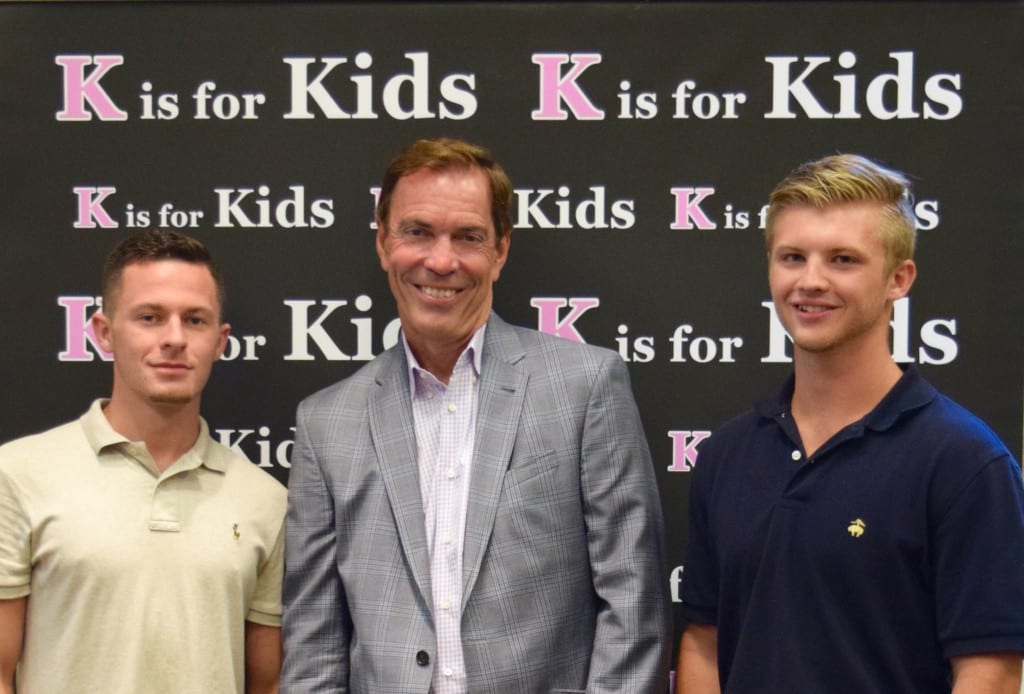 K is for Kids' Young Entrepreneurs 2015 were Tyler Schult at left and Hadrien Roy at right (both are recent graduates of Barron Collier High School. Craig Bouchard, international entrepreneur and New York Times bestselling author is shown at center.