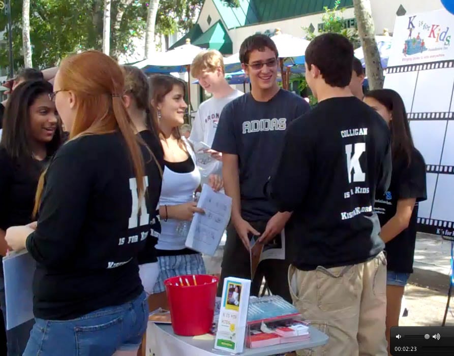 Photo of CityFest 2010 Teens collaborating before event for children. Haylee, at center, stands next to her brother Matthew as the Teen Advisory Team prepared to help children write storyboards for their giant filmstrip on canvas at Naples CityFest 2010.