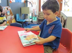 KisforKids_PreschoolBoyWithClothBook_ImmokaleeFarmWorkersVillage_IMG_0408