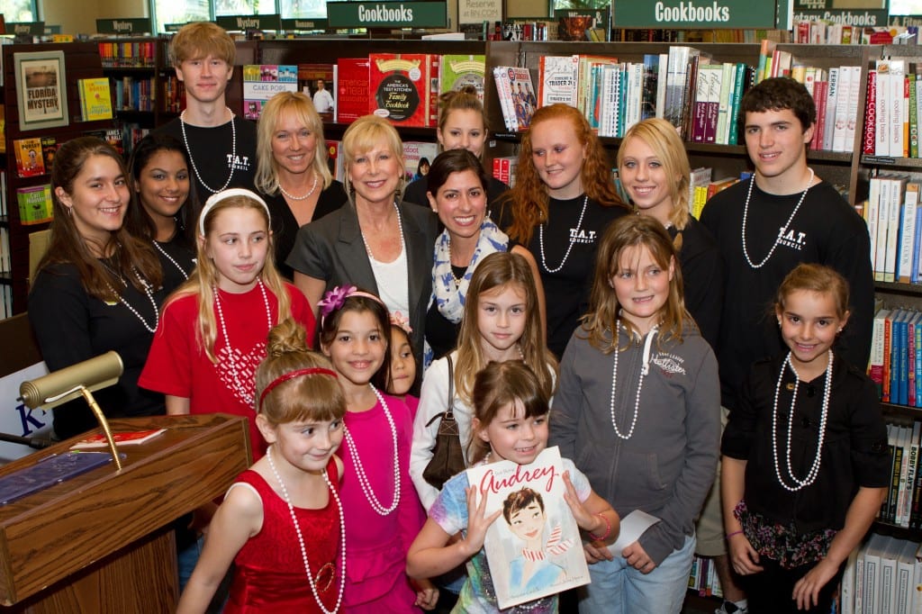 The First Lady of Florida Ann Scott stands with K is for Kids' Founder Karen D. Clawson (at left) and HarperCollins published author Margaret Cardillo and are surrounded by children of all ages at the 2011 "Kids Celebrate Reading" Book Fair held at Barnes & Noble, Waterside Shops in Naples. Standing in the back row are members of K is for Kids' Teen Advisory Team Council, and amongst this year's graduating seniors. From left to right: Marina Moussa, Tyler Clevett, Amber Valcante, Haylee Lamb, Erin Clawson and Matthew Colligan. The children are featured in the third commemorative K is for Kids' young authors book, "Wishes, Dreams & Who Inspires Me." The theme of the book fair in honor of the First Lady and Audrey Hepburn, the subject of Ms. Cardillo's biographical book "Just Being Audrey." All participants were given white beads in honor of the late actress' fondness for fashion..