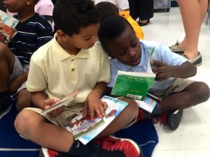 8 Operation Outreach - Boys Look at New Books Donated by K is for Kids thanks to BN