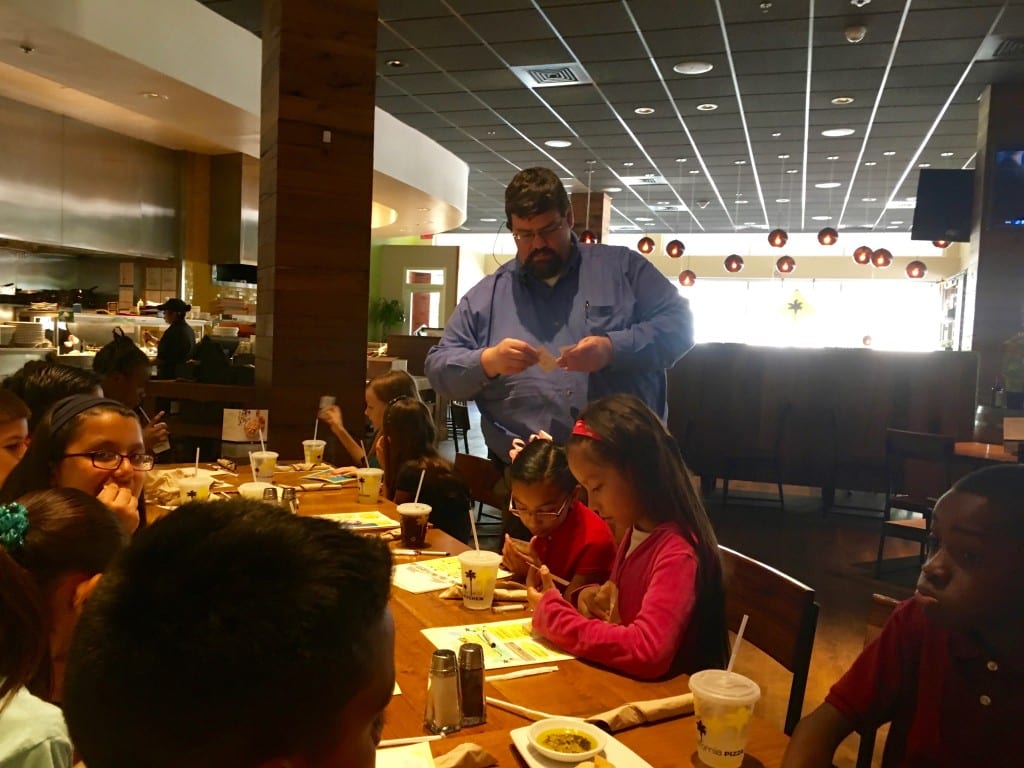 AES at CPK - Mgr. Rich Hallas gives honorees cards for complimentary kids meal