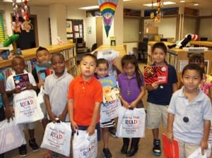 LTES_PHOTO_GroupOf8_withBooks_byDanielPerez