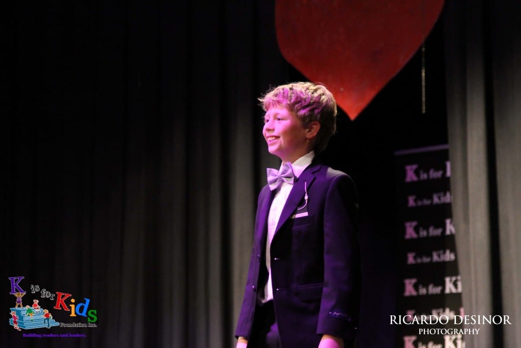 Calverton Manuszak, a sixth grade student at Pine Ridge Middle School, models a tuxedo from Men's Wearhouse